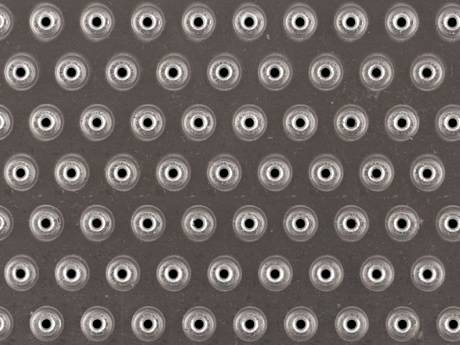Non-slip flooring with hundreds of perforated buttons for all-directions friction.
